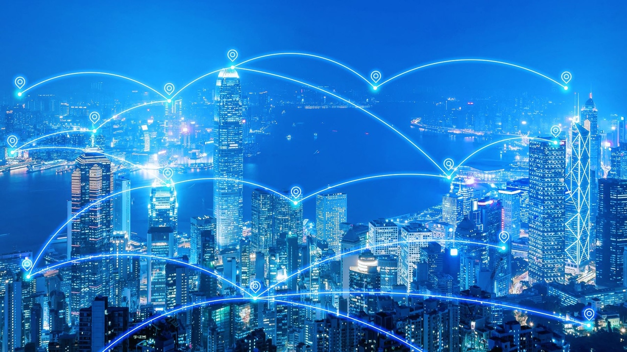 Overlay indicating the use of IoT (Internet of Things) on top of a city skyline Overlay indicating the use of IoT (Internet of Things) on top of a city skyline