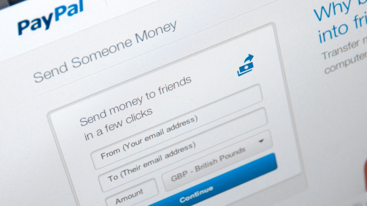 PayPal website page open on a computer screen displaying how people can send money using the service