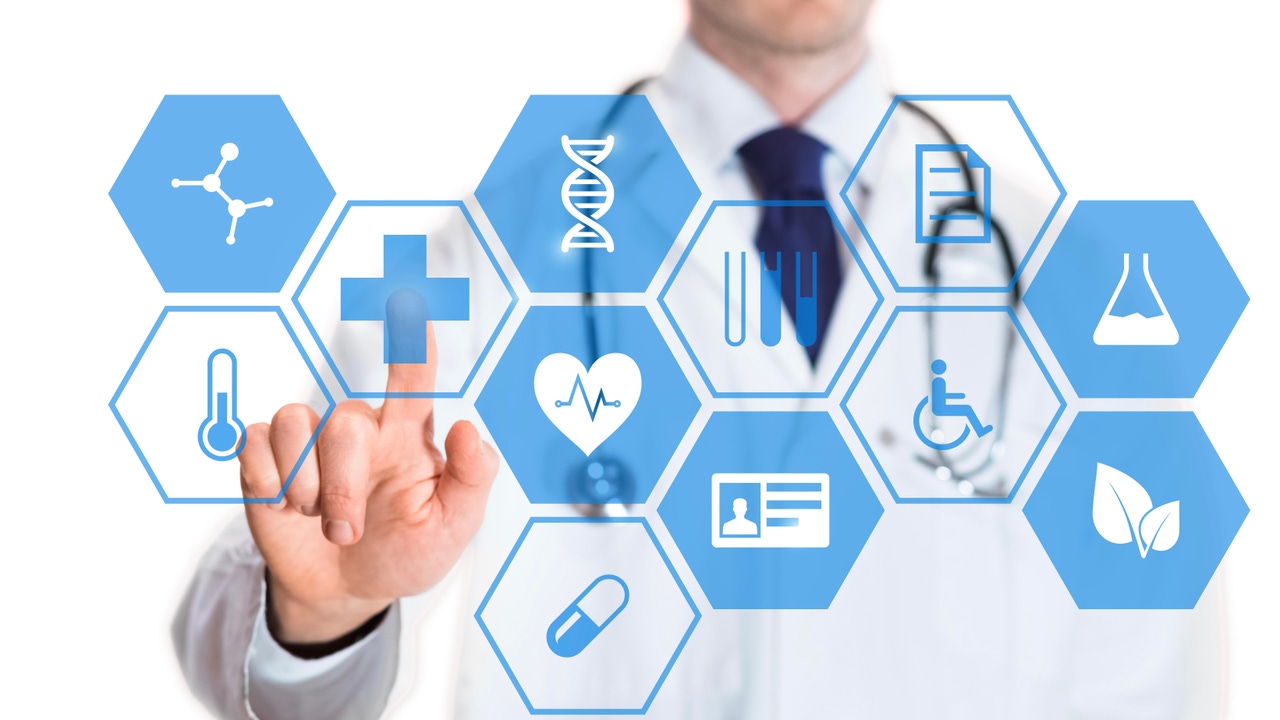 Medical doctor touching virtual interface button of healthcare applications